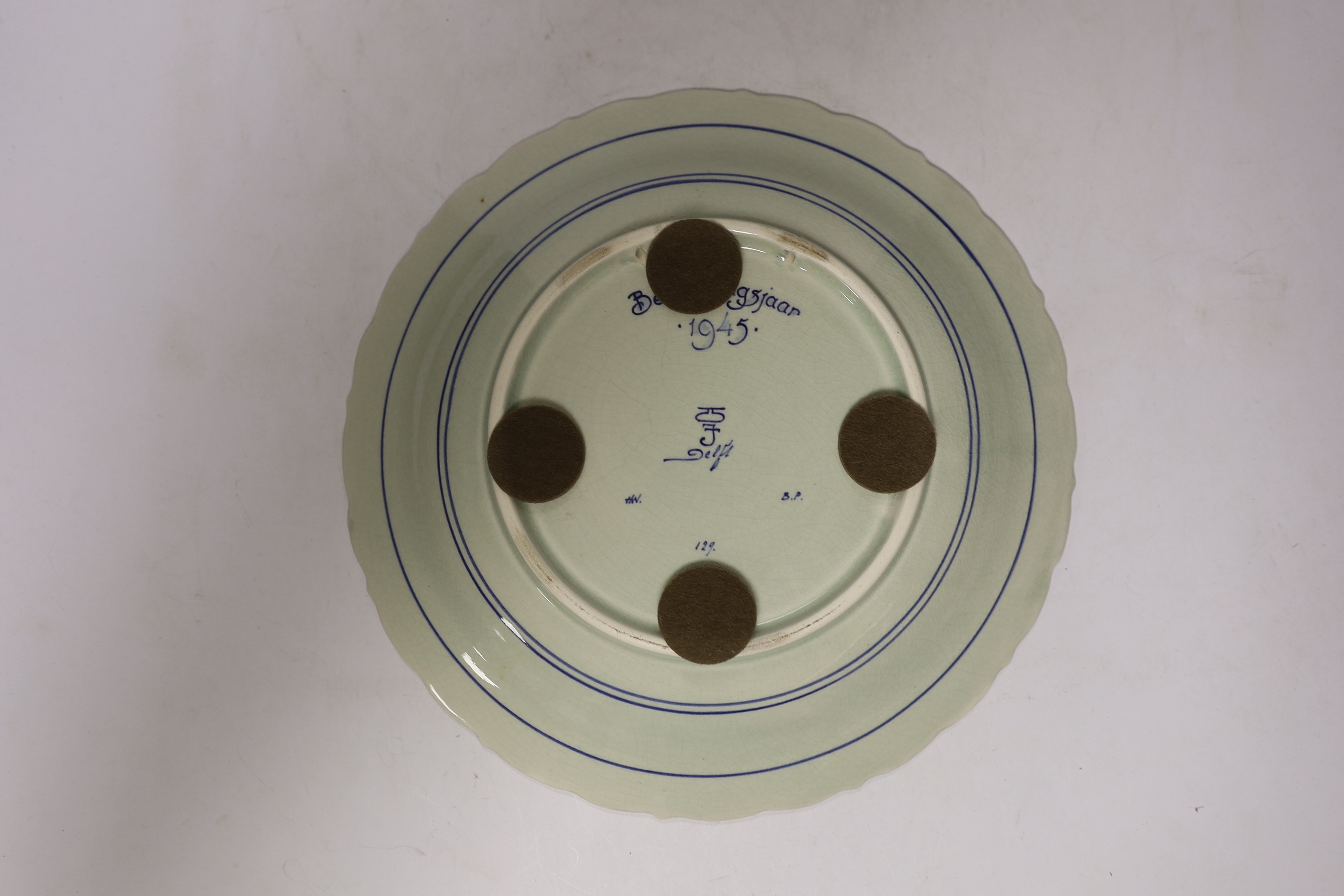 A late 18th century Delft garniture of three vases, two with covers, 32cm, together with a modern Delft plate
